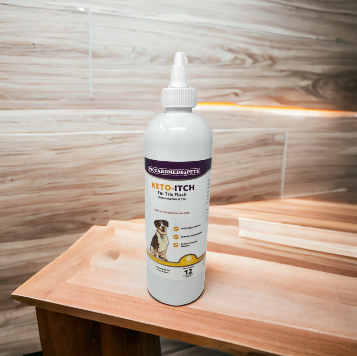 Keto Itch bottle on a wooden surface with a wooden wall background