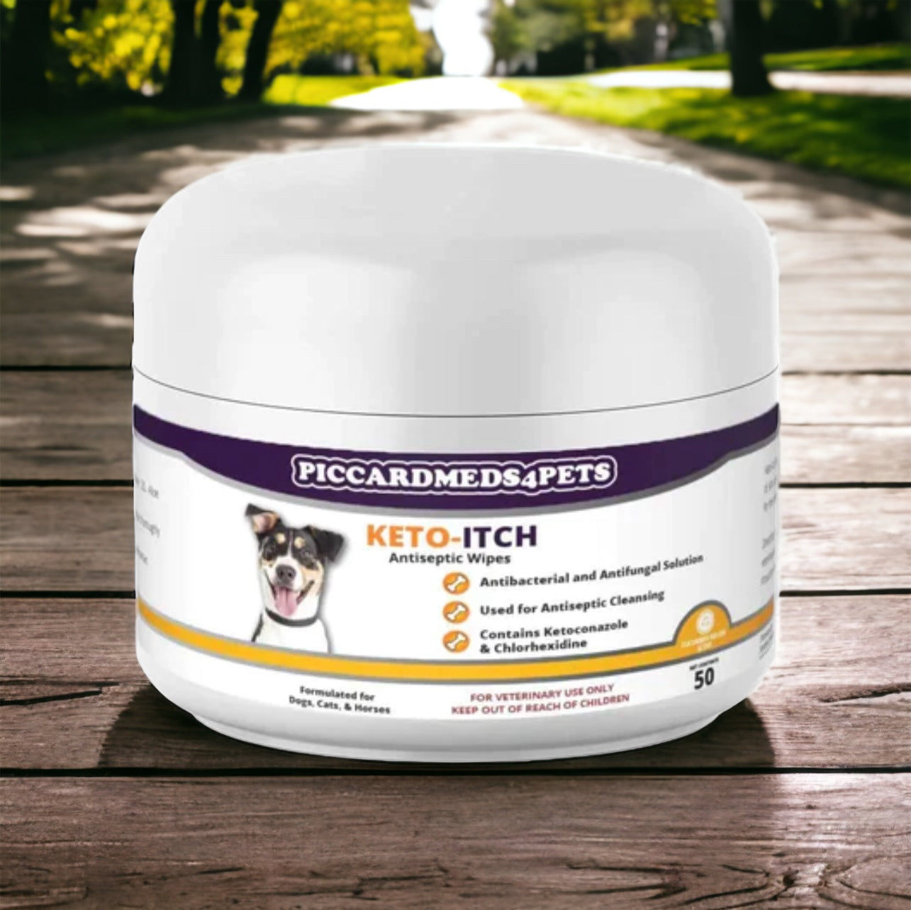 Jar of Piccardmeds4Pets Keto-Itch Antiseptic Wipes on a wooden surface with a park background