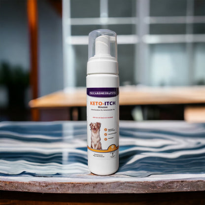 Keto-Itch mouse spray bottle on a table with a blurred background