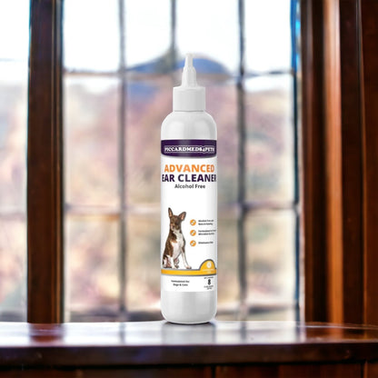 Bottle of Piccard Medi-Pets Advanced Ear Cleaner on a wooden surface with a window in the background
